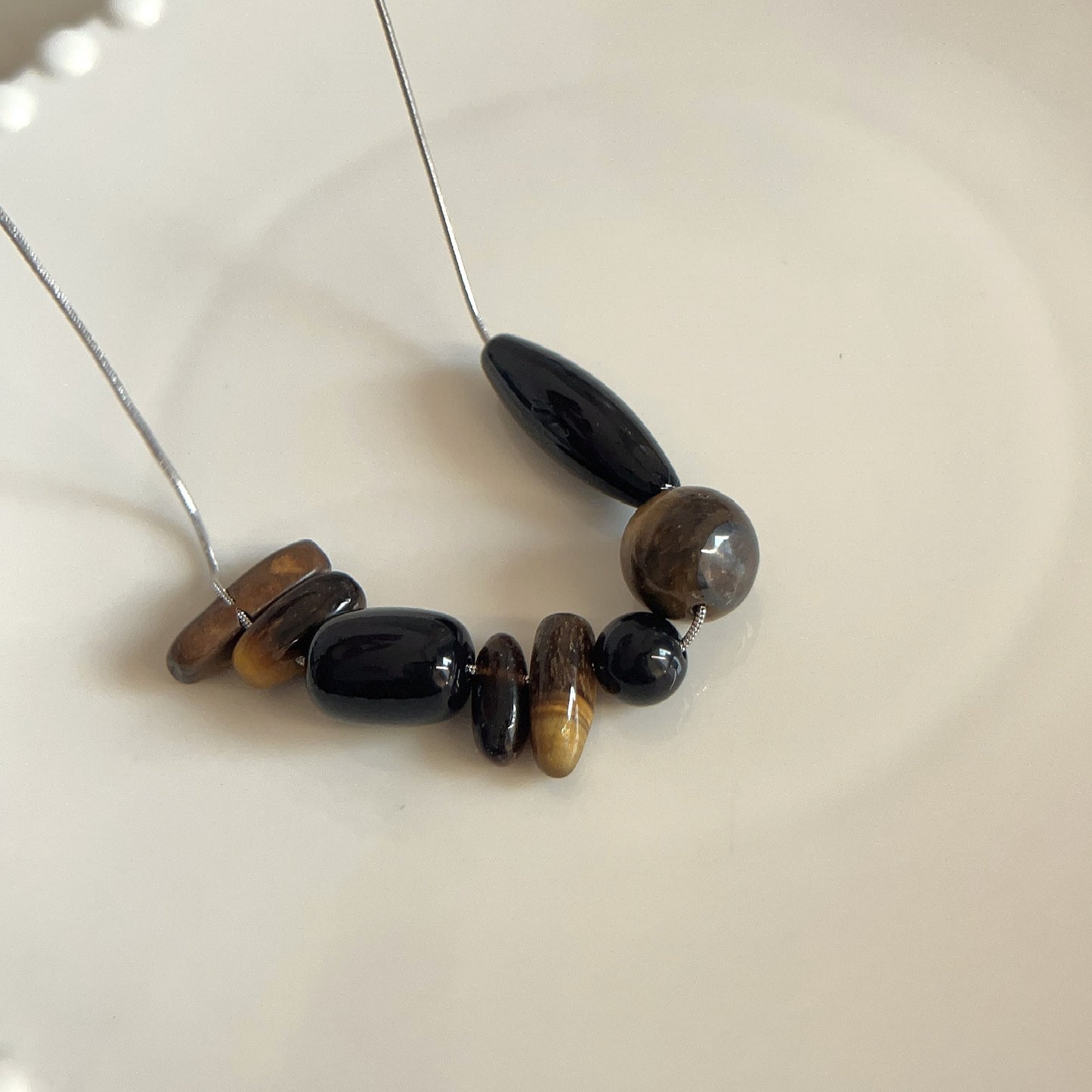 Unique irregular stone stitched string necklace